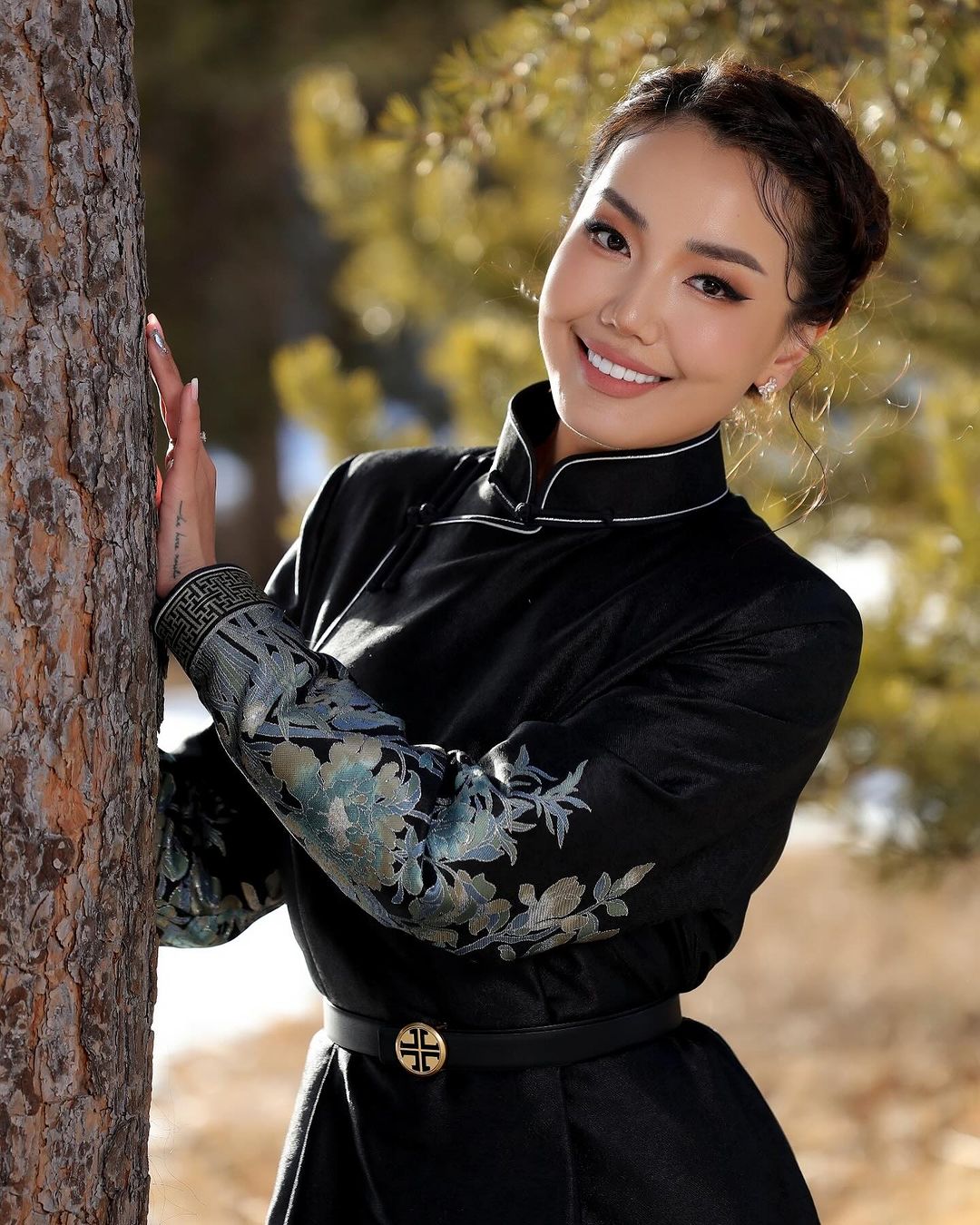 Mongolian women wear black deel clothes