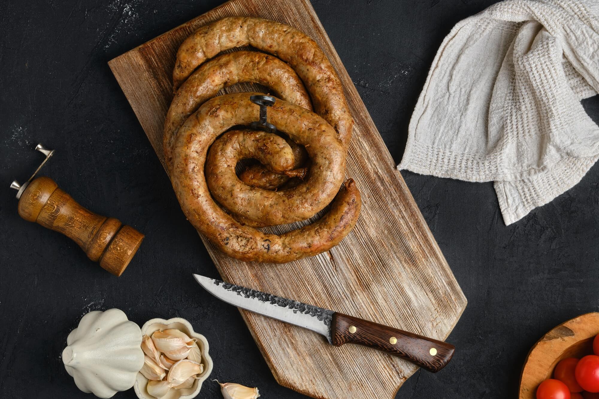 horse meat sausage rolled on wooden cutting board 2022 03 29 07 38 00 utc